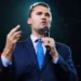 Charlie Kirk speaking at a public event before an audience during his career as a political activist and media personality.